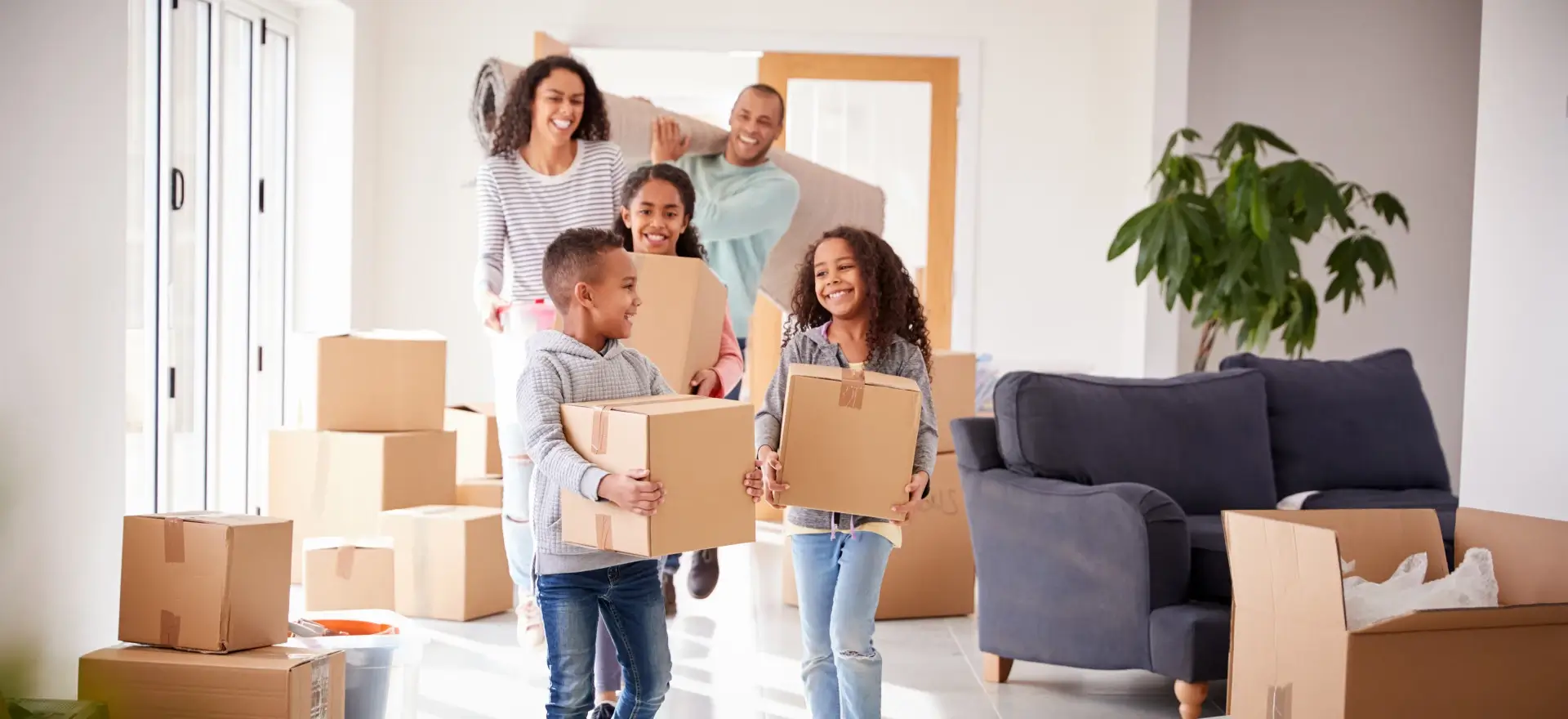 Happy family moving in to their new home thanks to Clear Choice Lending